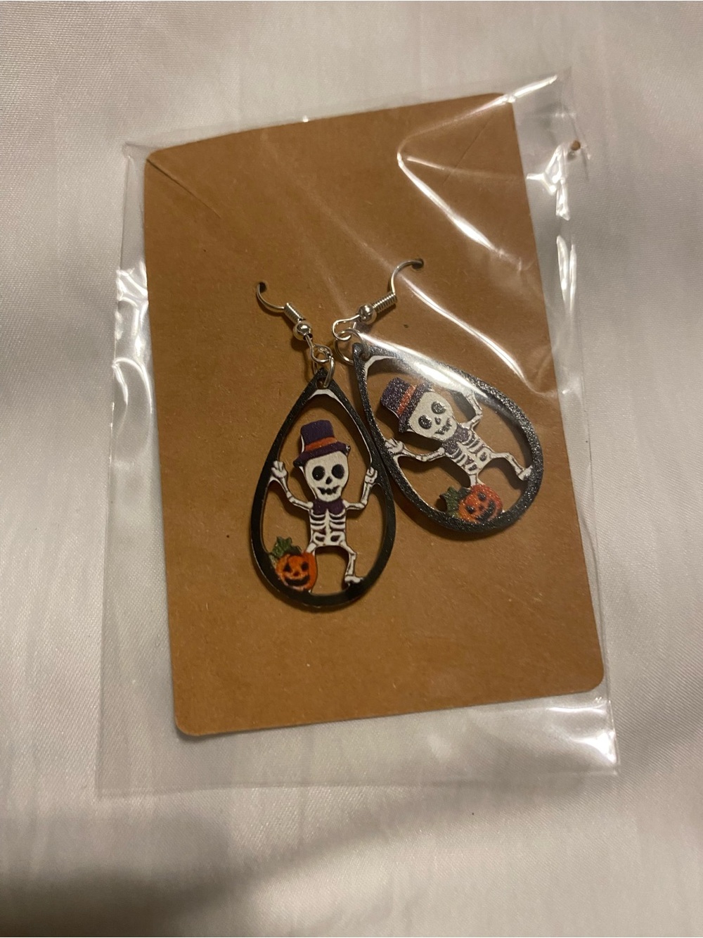 Hand Crafted Black Teardrop Skeleton Earrings with Orange Pumpkin Accent